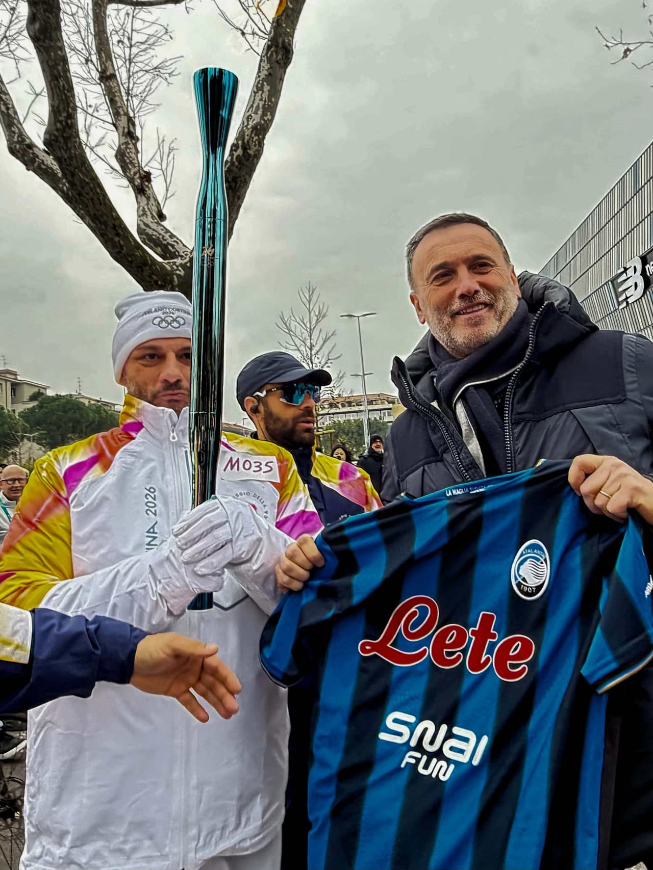 The Olympic Flame lighting up the New Balance Arena