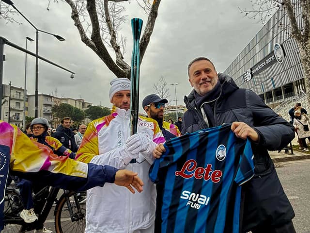 The Olympic Flame lighting up the New Balance Arena